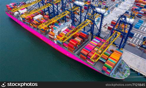 Container ship loading and unloading in deep sea port, Aerial view of business logistic import and export freight shipping transportation by container ship in open sea.