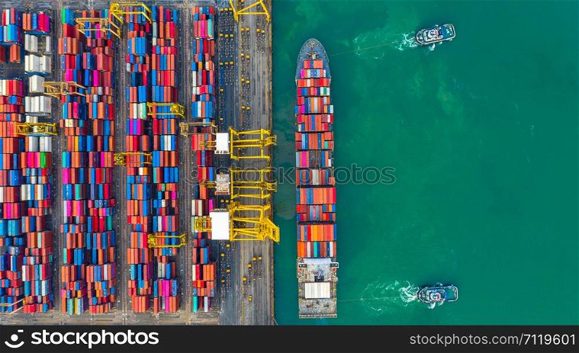 Container ship working at industrial port, Business import and export logistic and transportation of International by container ship in the open sea, Aerial view container ship loading and unloading.