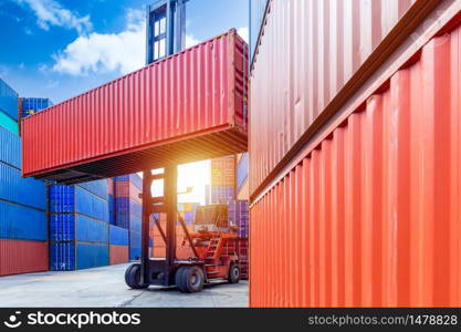 Container stacker crane lifting up stacking container box in yard, Container loading cargo freight in import and export business logistic company, Industry logistic and transportation