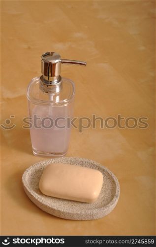 container with liquid soap and bar of soap (wooden background)