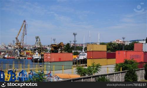 Containers and cranes in harbour yard