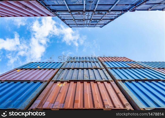 Containers box from cargo freight ship with blue sky background, Industrial container yard for business commercial trade logistic transportation oversea worldwide Import Export, Stack of colorful cargo freight ship container.