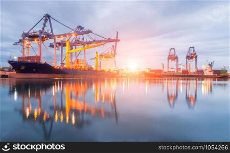 Containers loading Shipping by crane at morning or Trade Port