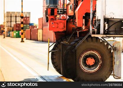 Containers with forklift car. Cargo in harbour with transport vehicle. Maritime transportation commerce concept. . Containers with forklift car.