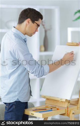 contemplative male artist painting