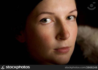 Contemplative woman, close-up, portrait