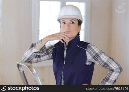 contemplative woman in renovation property