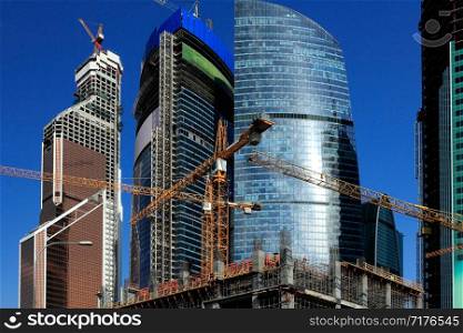 Contemporary architecture and construction site in Moscow City business center.