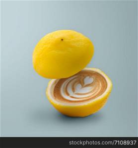 Contemporary art of Lemon with coffee inside on blue background, minimal style. Idea concept of fruit.