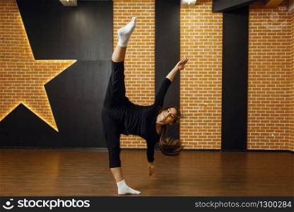 Contemporary dance performer, woman in studio, body flexibility. Dancer on workout in class, modern ballet, elegance dancing, stretching exercise. Contemporary dance performer, woman in studio