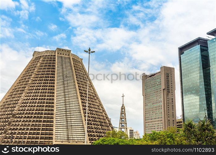 Contemporary Metropolitan Cathedral of Saint Sebastian and modern skyscrapers buildings, downtown of Rio De Janeiro, Brazil