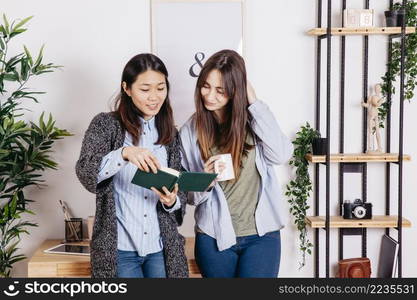 content girls reading book together