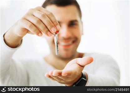 content man holding new keys