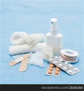 Content of First aid kit plasters, bandage and pills
