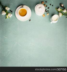 Continental breakfast captured from above top view, flat lay . Coffee, orange juice, croissants, jam, berry, milk and flowers. Blue concrete worktop as background. Layout with free text copy space.. Continental breakfast on blue background captured from above
