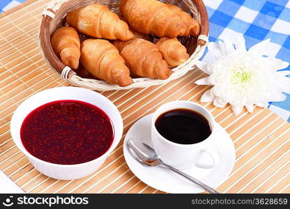 Continental breakfast with croisant and black coffee