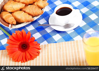 Continental breakfast with croisant and black coffee