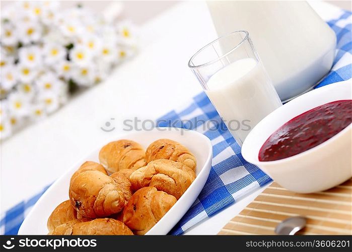 Continental breakfast with croisant and glass of milk