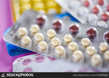 Contraceptive pill Prevent Pregnancy Contraception birth Control concept - oral contraceptive pills on pink background
