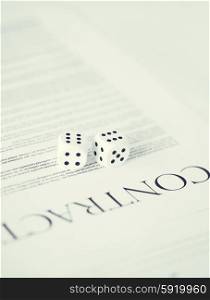 contract paper with gambling dices. picture of contract paper with gambling dices