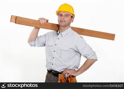 Contractor carrying timber