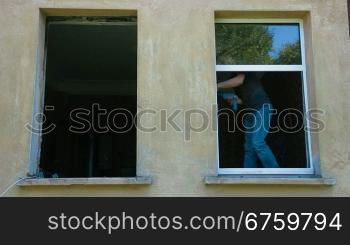 Contractor installing new double glazed windows