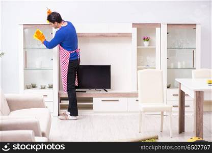 Contractor man cleaning house doing chores