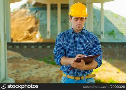 contractor writing in clipboard