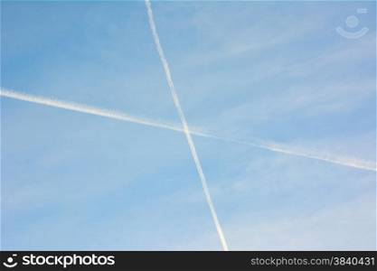 contrails in the blue sky