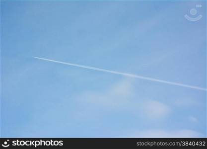 contrails in the blue sky