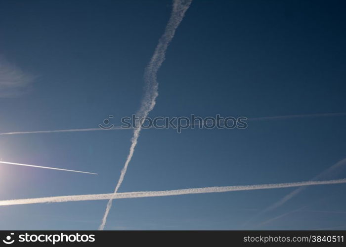 contrails in the blue sky