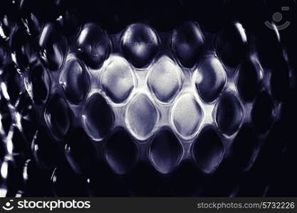 Contrast glass background with geometric pattern macro