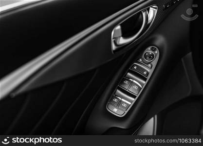 control panel. details of the car interior, black leather interior. details of stylish car interior, leather interior. control panel