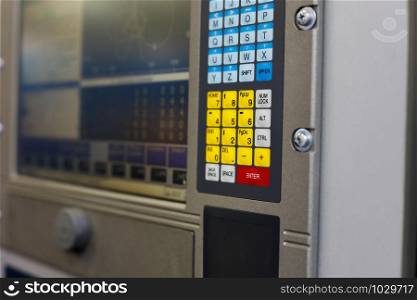 Control panel of a computer controlled industrial equipment. Selective focus.