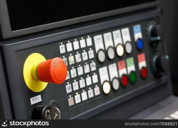 Control panel of CNC machining center. Closeup view. Selective focus.