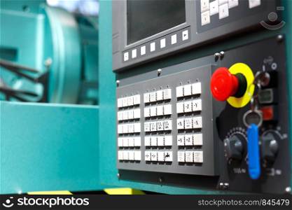 Control panel of modern metalworking cnc machine center. Selective focus.