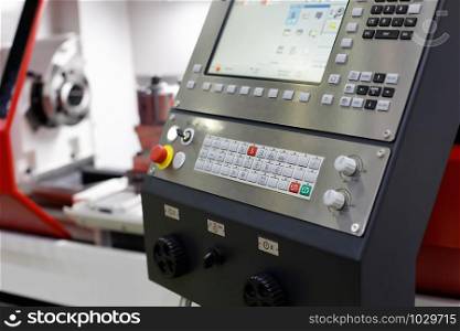 Control panel of the CNC machining center. Selective focus.