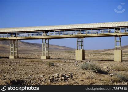 Conveyor on the columns in the Negev desert, Israel