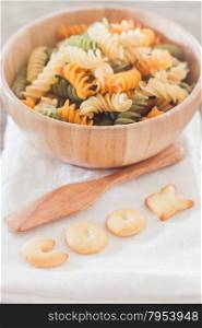 Cook alphabet biscuit with fusili pasta, stock photo