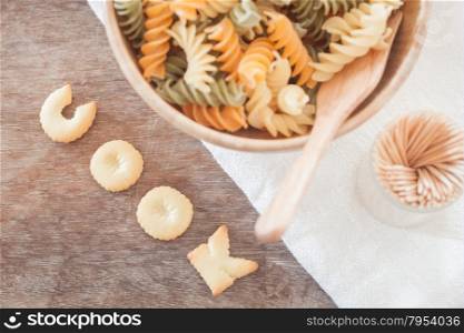 Cook alphabet biscuit with fusili pasta, stock photo