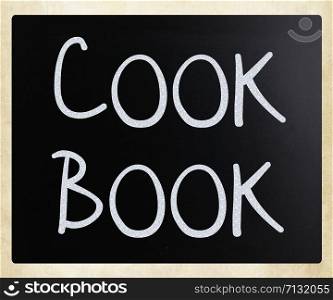 ""Cook book" handwritten with white chalk on a blackboard"