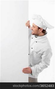 Cook looks to an empty board on a white background
