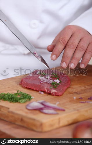 Cook preparing meal