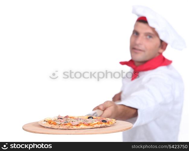 Cook serving pizza