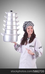 Cook with stack of pots on white