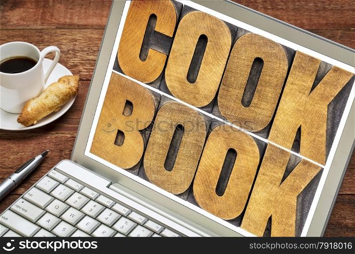 cookbook word abstract - text in letterpress wood type on a laptop screen