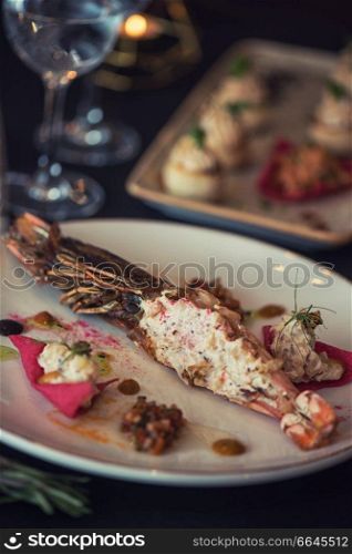 Cooked and stuffed crayfish on the table. Tasty restaurant dish. Cooked and stuffed crayfish