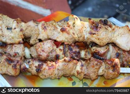 cooked appetizing barbecue. appetizing barbecue with great pieces of meat