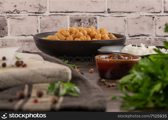 Cooked hickpeas in a bowl on kitchen countertop.