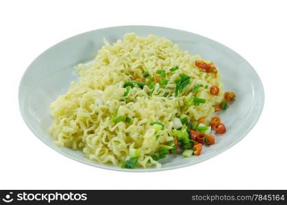 cooked instant noodles with chili and vegetable on dish over white background